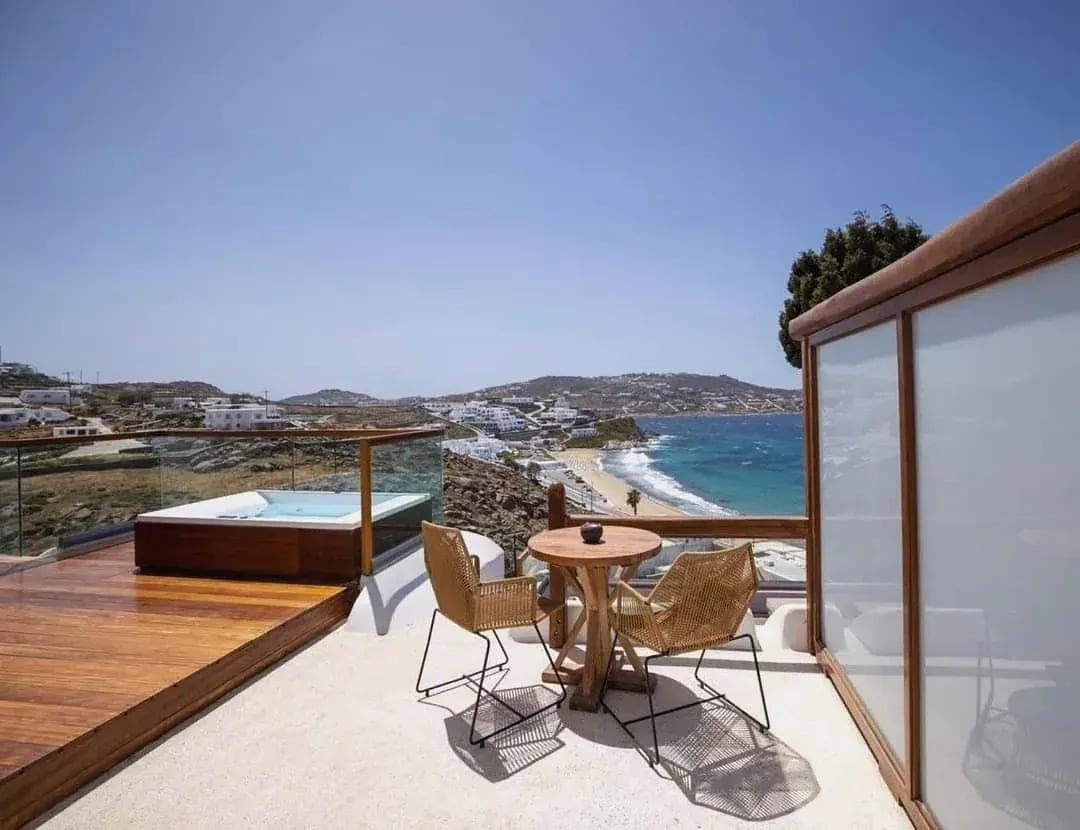 Terrace seating and hot tub looking towards the beach below