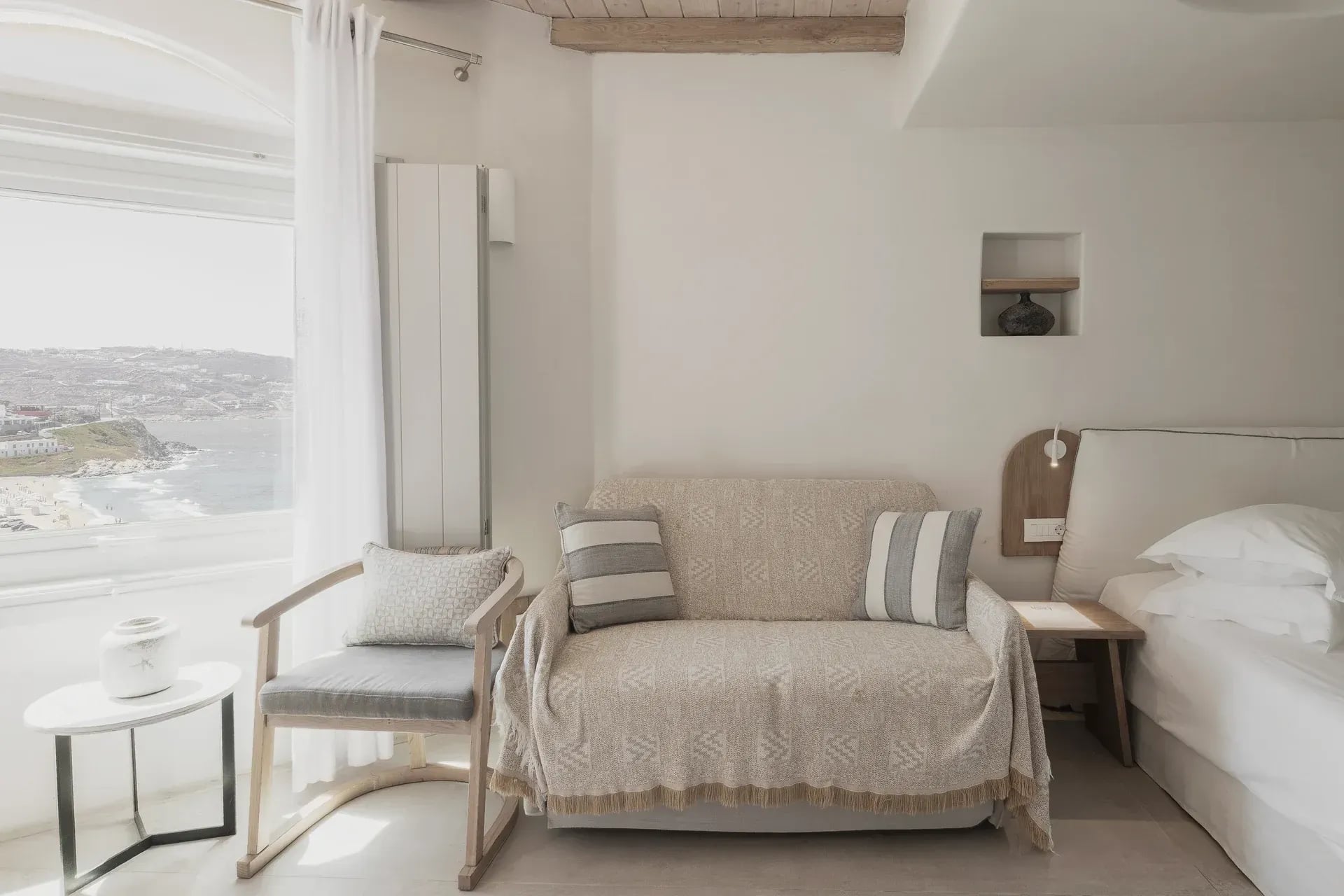 Armchair beside the sea-facing window in the Superior Suite