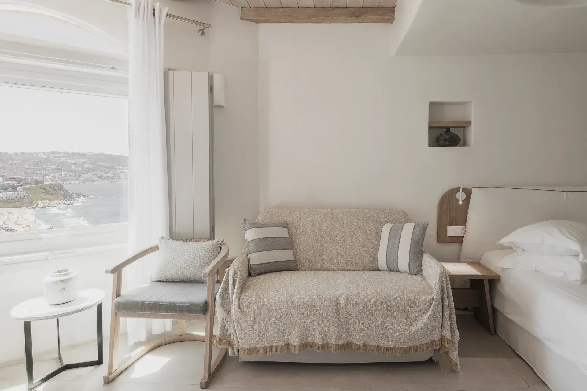 Armchair beside the sea-facing window in the Superior Suite