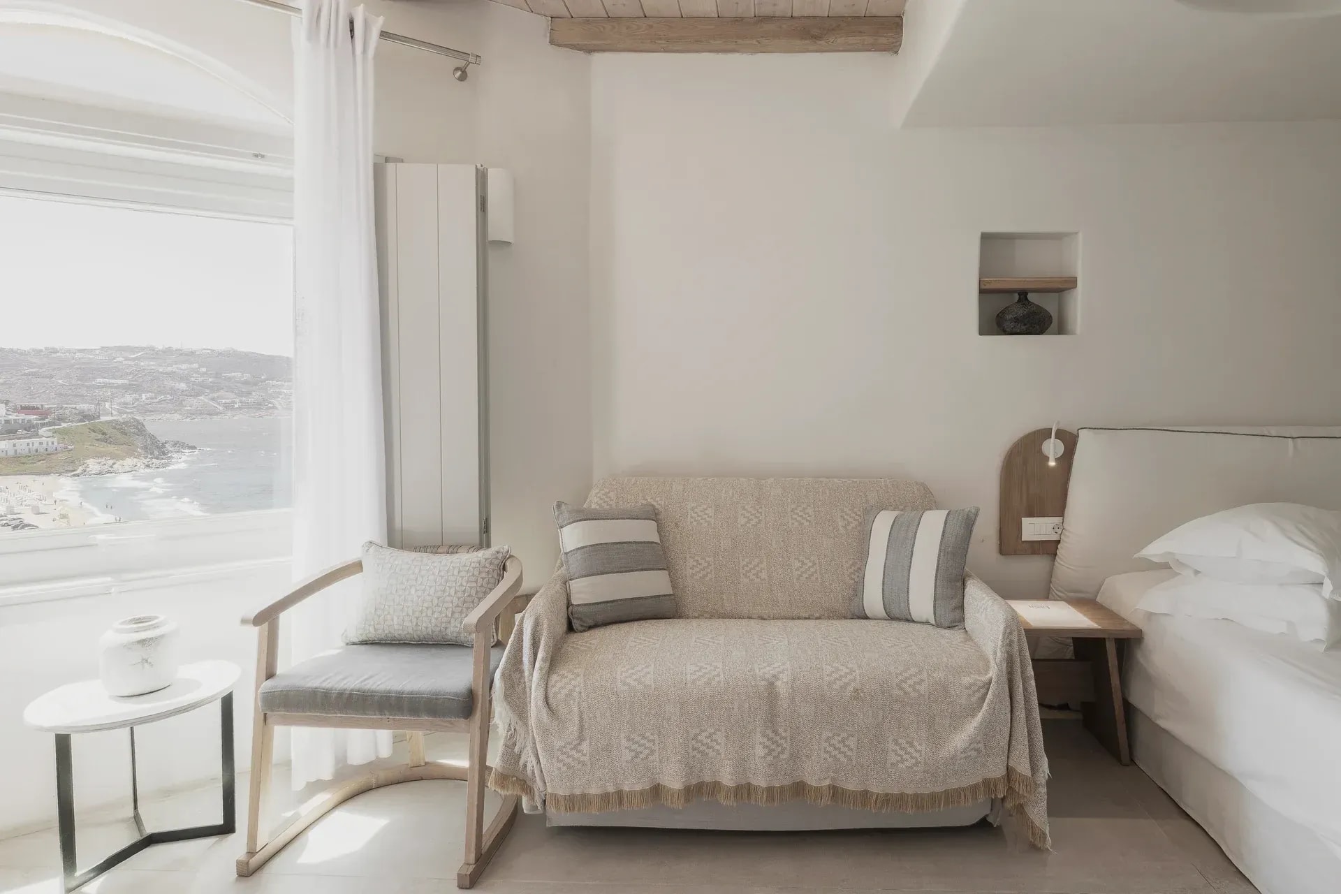 Armchair beside the sea-facing window in the Superior Suite